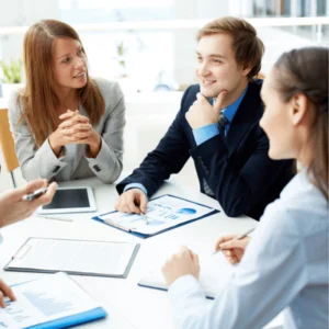 Office team discusses strategy, exploring managed it services that streamline operations, security, and support effectively